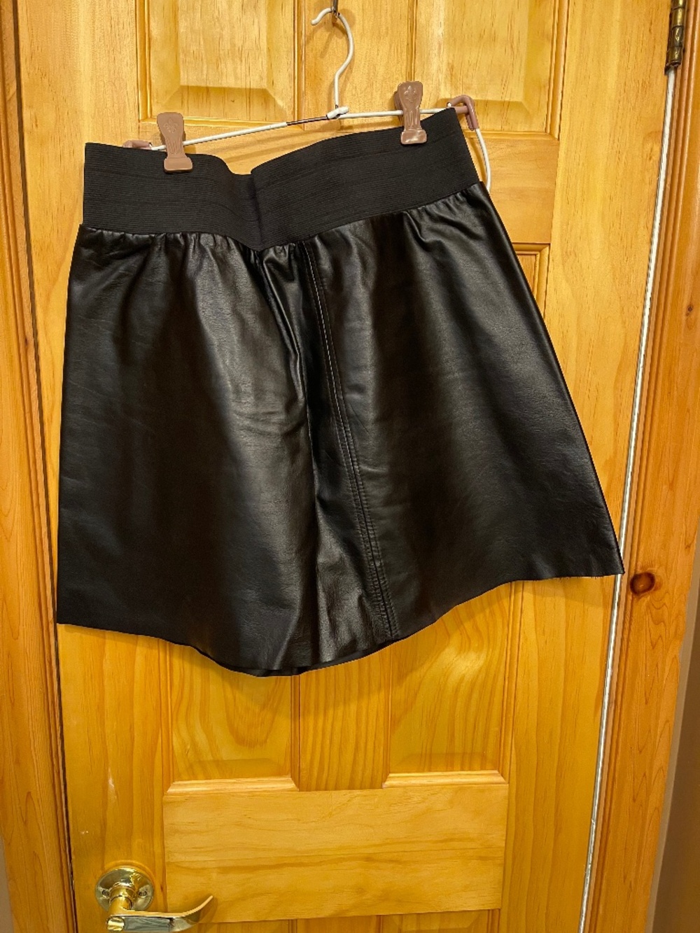 Assorted Woman leather clothes, and some men’s leather items like new